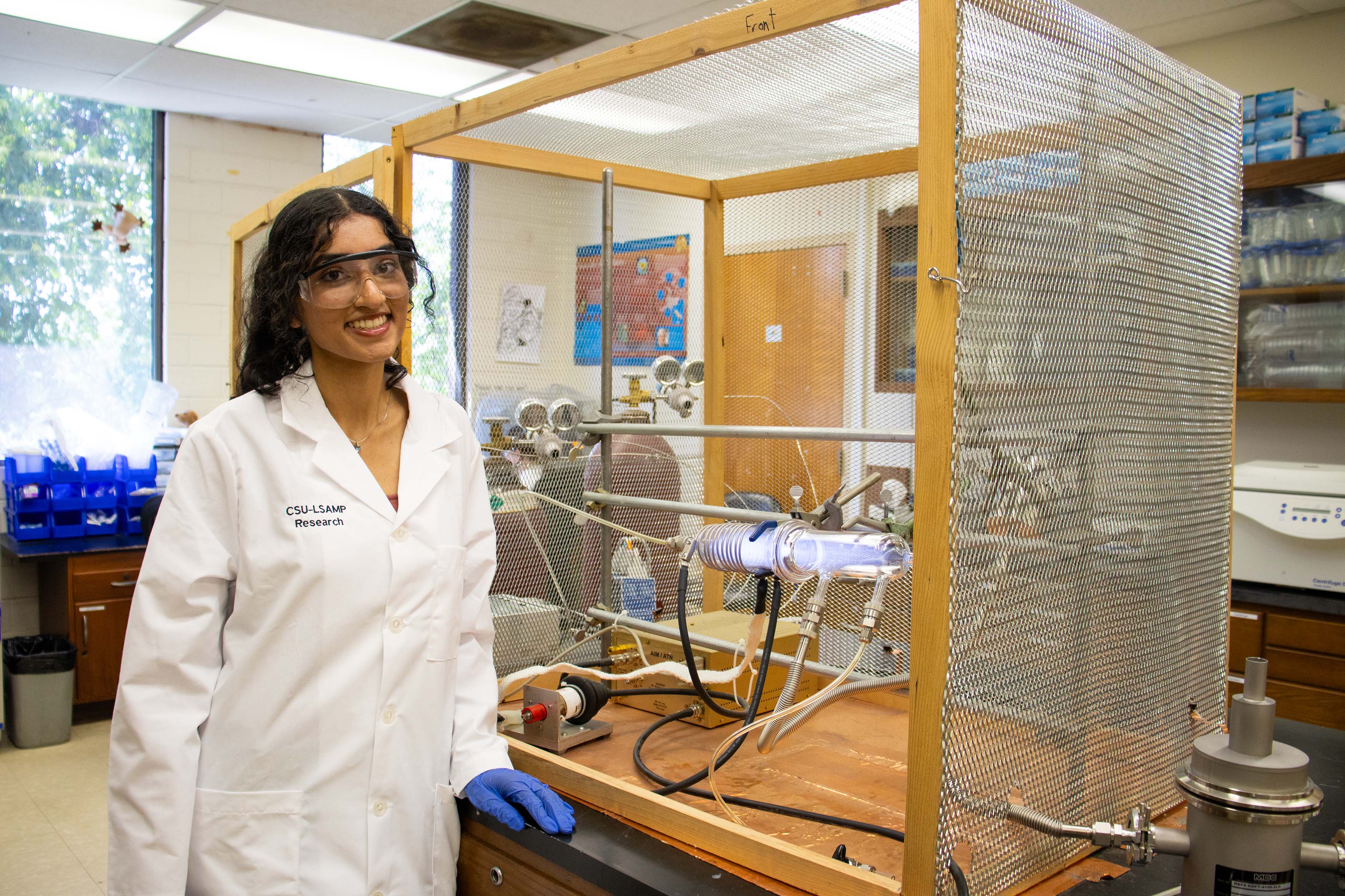 Female SPA student in a laboratory setting.
