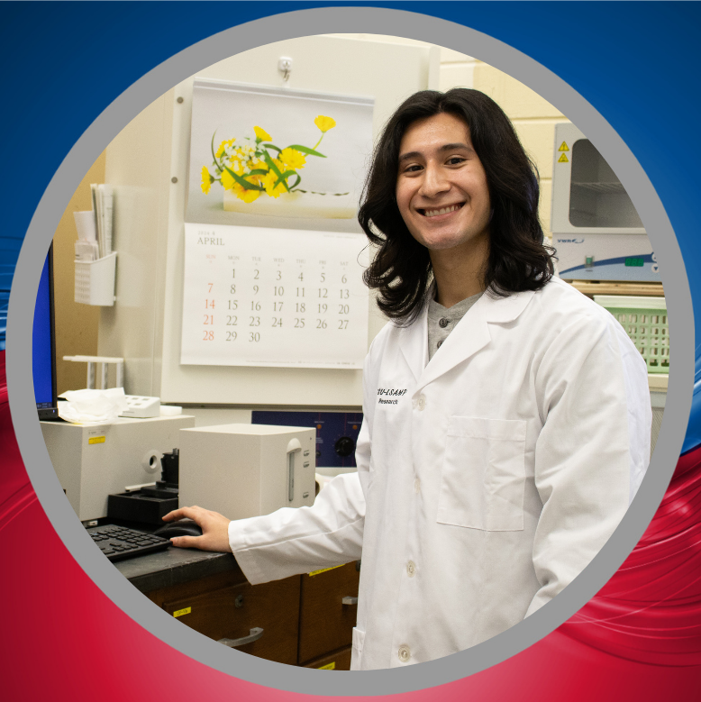 John gutierrez standing in a lab