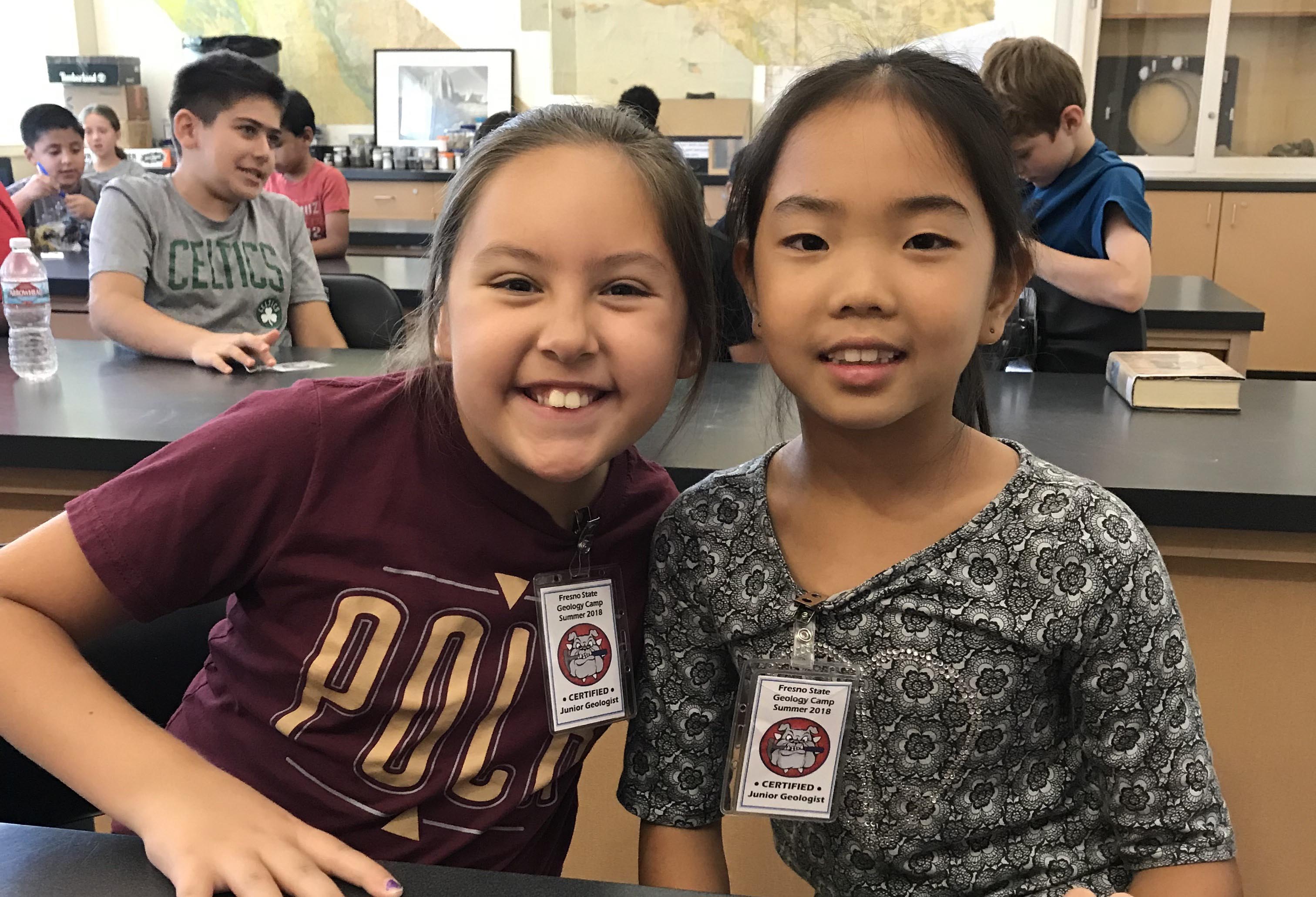 Two children smiling for the camera at Fresno State's Geology Camp