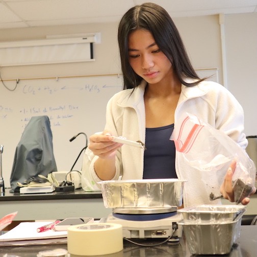 BOND research student performing a soil analysis sample