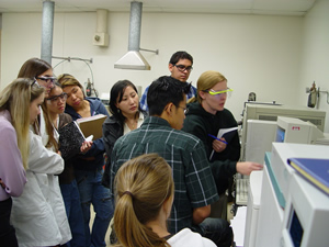 students learning about a GC-Mass Spec Instrument