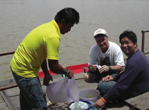 Dr. Steve Blumenshine (center) in Thailand